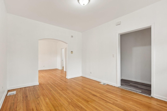 spare room featuring light hardwood / wood-style flooring