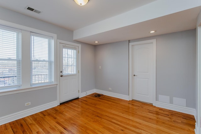 interior space with baseboards, visible vents, recessed lighting, and light wood-style floors