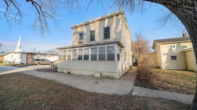 front of property with a sunroom