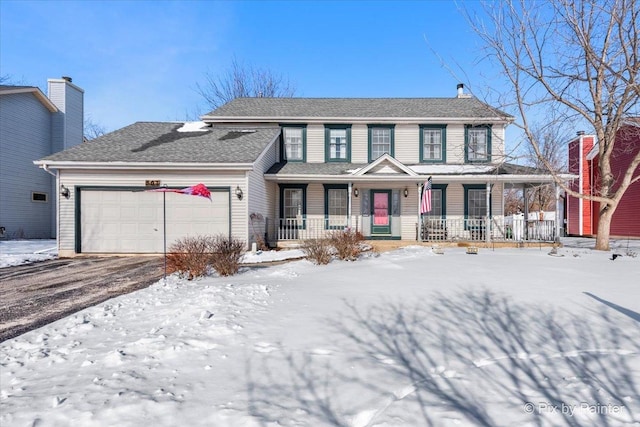 view of front of home with a garage and a porch