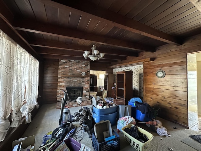 interior space with beam ceiling, wood walls, and a notable chandelier