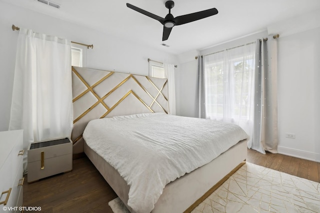 bedroom with ceiling fan and hardwood / wood-style flooring