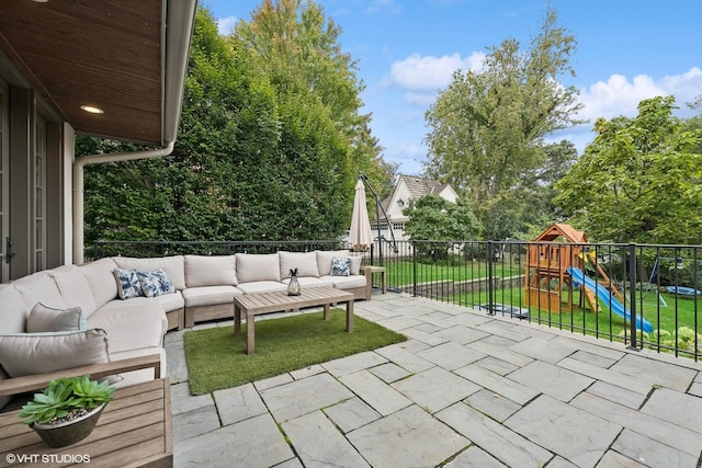 view of patio featuring a playground and an outdoor hangout area