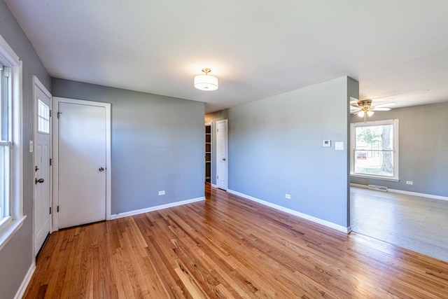 spare room with ceiling fan and light hardwood / wood-style flooring