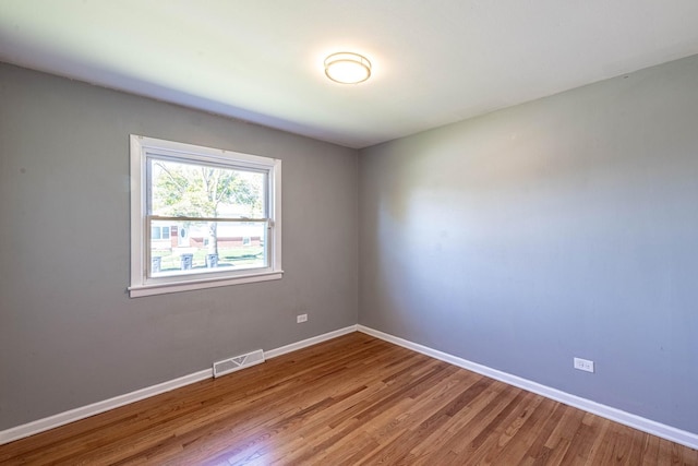 spare room featuring hardwood / wood-style flooring