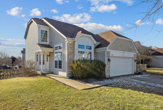 view of front facade with a front yard and a garage