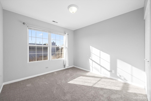 unfurnished room featuring carpet floors