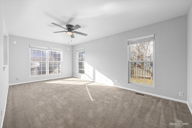 carpeted empty room with ceiling fan