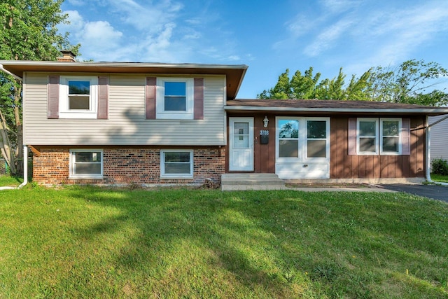 split level home with a front yard