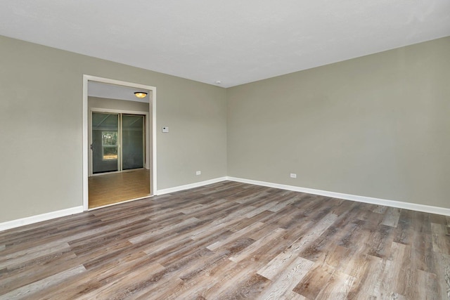 spare room featuring light wood-type flooring