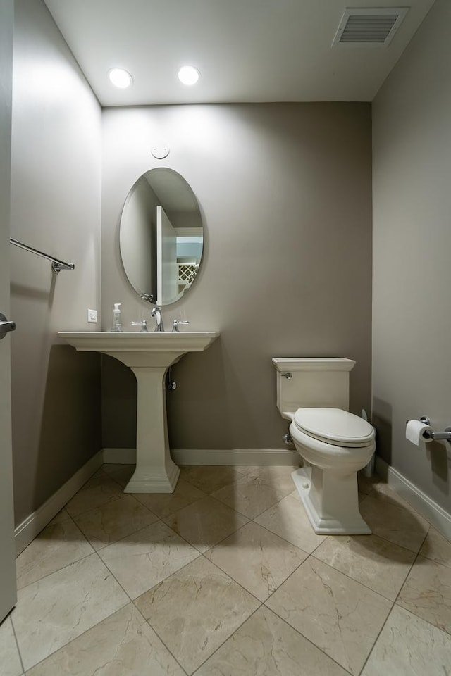 bathroom featuring toilet