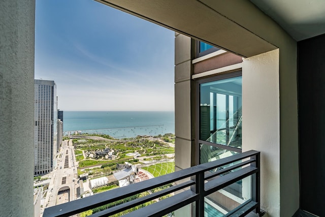 balcony featuring a water view