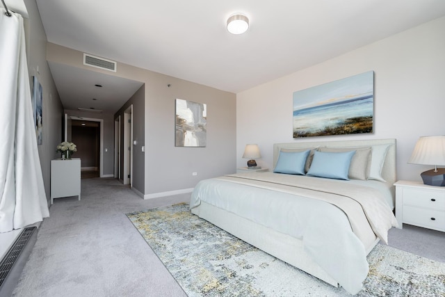 bedroom with light colored carpet