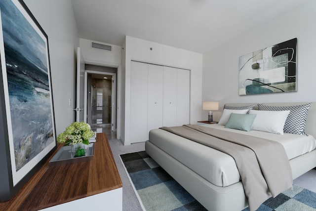 carpeted bedroom featuring a closet