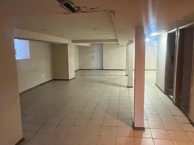 basement with light tile patterned floors