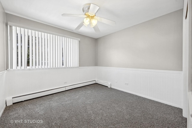 carpeted empty room featuring ceiling fan and a baseboard radiator