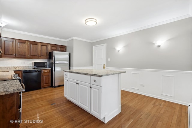 kitchen featuring a center island, white cabinetry, black dishwasher, light hardwood / wood-style floors, and stainless steel fridge