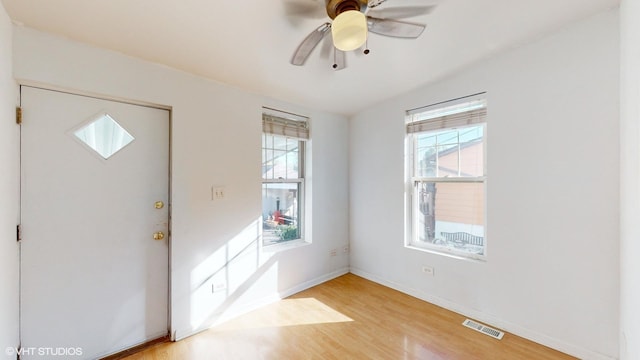 foyer entrance featuring ceiling fan and light hardwood / wood-style floors