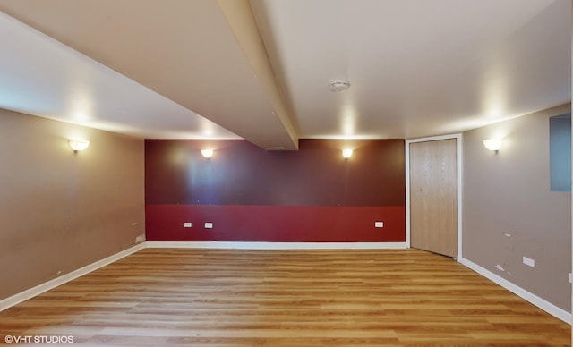 basement featuring light wood-type flooring