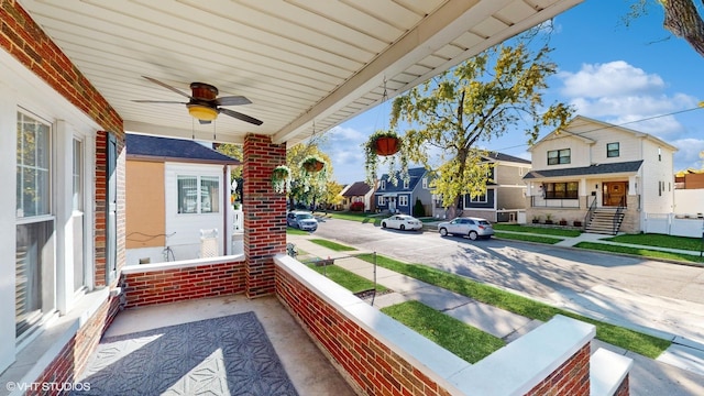 balcony featuring covered porch and ceiling fan