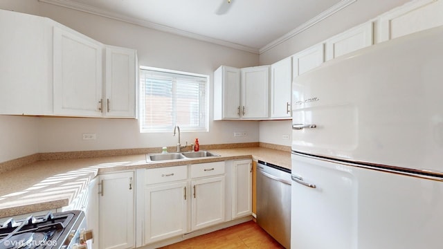 kitchen with white fridge, dishwasher, ornamental molding, white cabinets, and sink