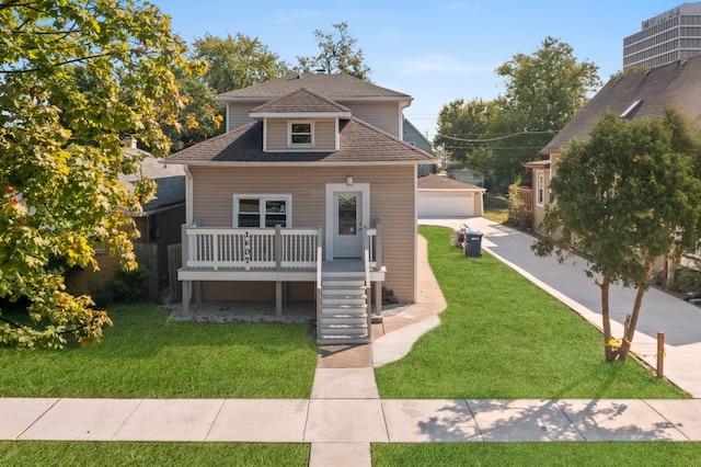 bungalow featuring a front lawn and cooling unit