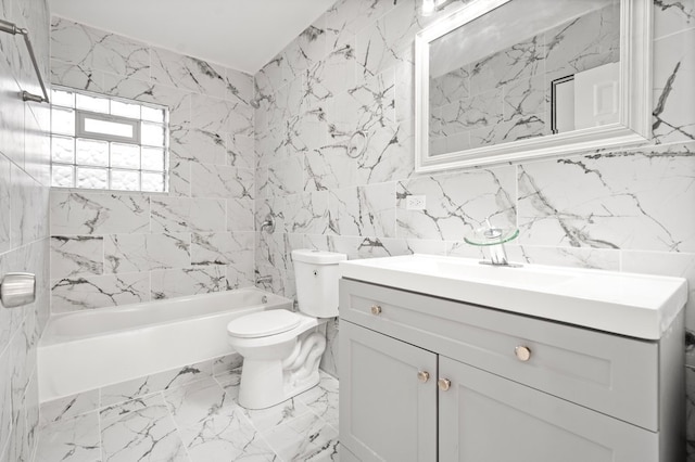 full bathroom featuring tile walls, tiled shower / bath combo, vanity, and toilet