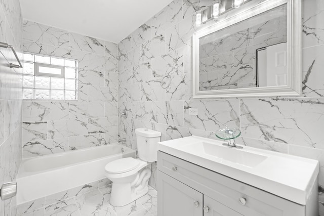 full bathroom with tile walls, toilet, vanity, and tiled shower / bath