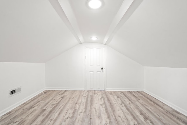 bonus room featuring vaulted ceiling and light hardwood / wood-style flooring