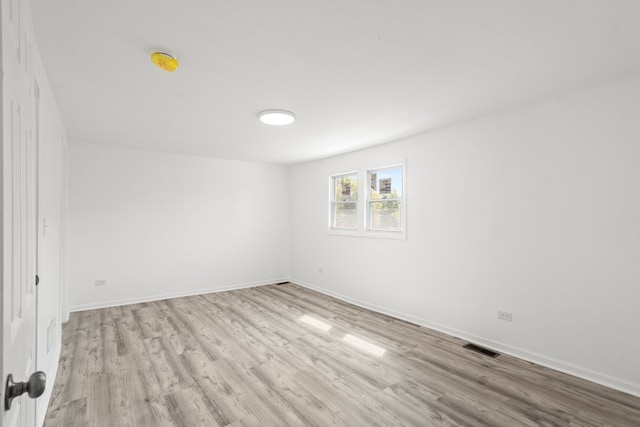 empty room with light wood-type flooring