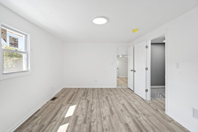 empty room with light wood-type flooring