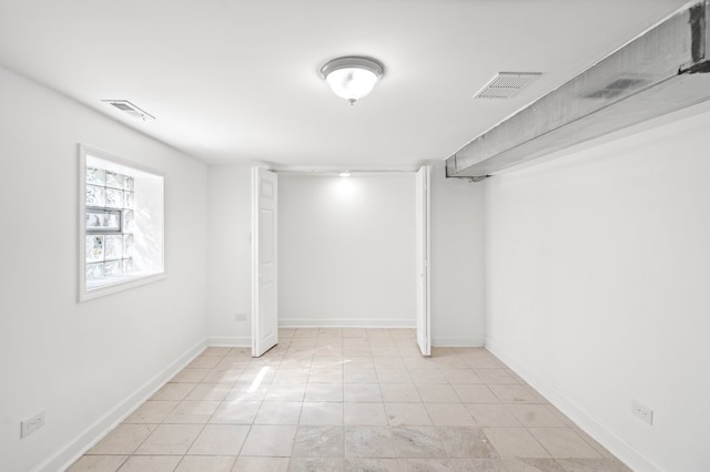 basement with light tile patterned floors