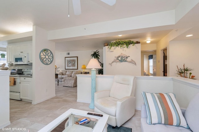 living room featuring ceiling fan and light tile patterned floors