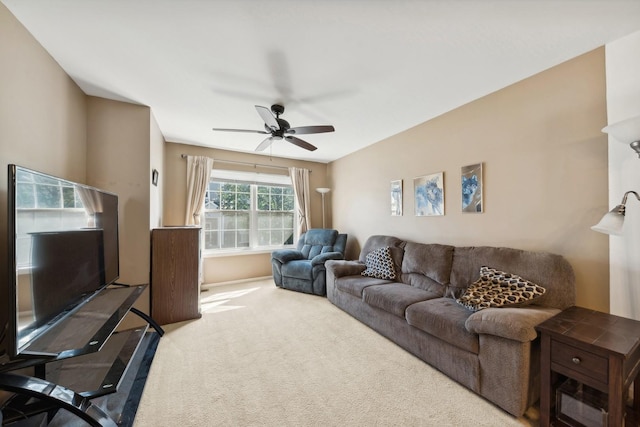 carpeted living room featuring ceiling fan