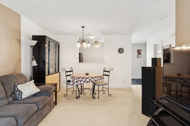 carpeted living room with a notable chandelier