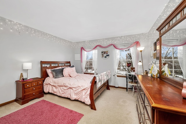 carpeted bedroom with multiple windows