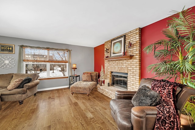 living room featuring hardwood / wood-style floors and a fireplace