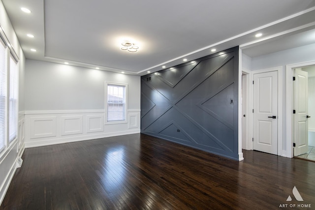 empty room featuring dark hardwood / wood-style flooring