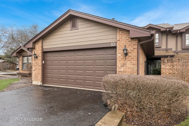 view of side of property with a garage