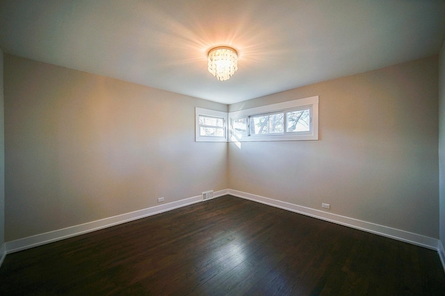 empty room featuring dark hardwood / wood-style floors