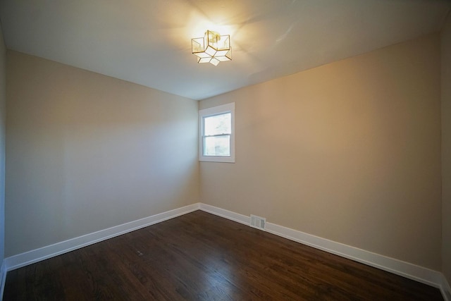 empty room featuring dark hardwood / wood-style floors