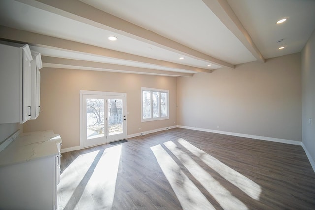 interior space with beamed ceiling and hardwood / wood-style floors