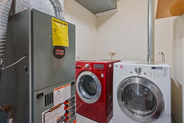 clothes washing area with heating unit and washer and clothes dryer