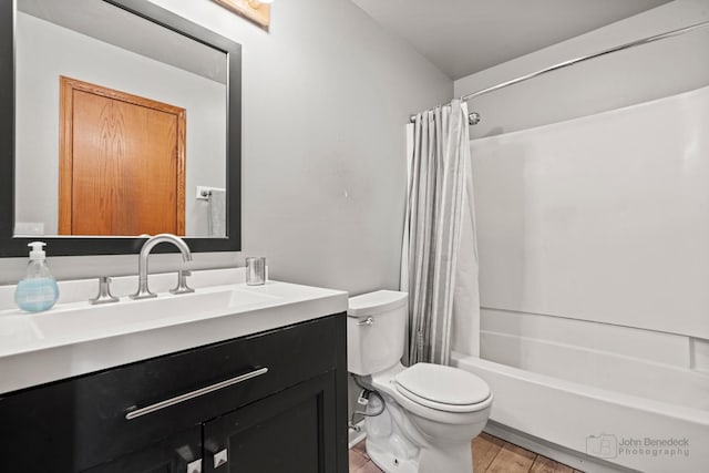 full bathroom featuring hardwood / wood-style flooring, toilet, vanity, and shower / bathtub combination with curtain