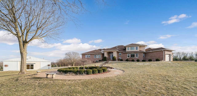 view of front of property featuring a garage and a front lawn