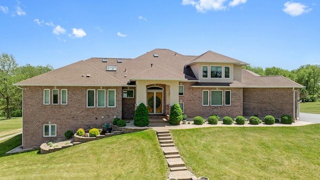 14481 Berglund Rd, Pecatonica, IL 61063 - view of front of property with a front yard, brick siding, and a shingled roof