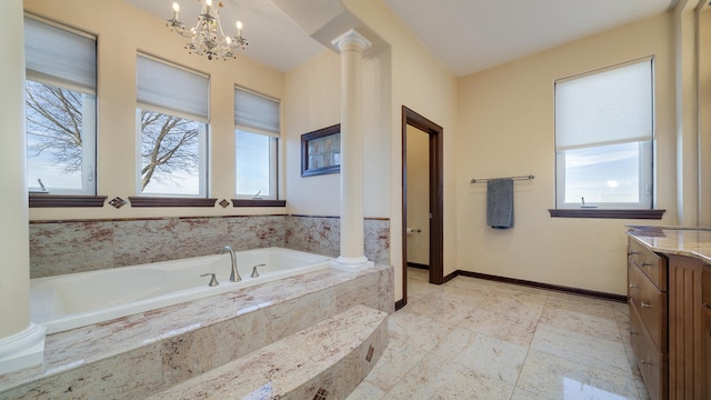 14481 Berglund Rd, Pecatonica, IL 61063 - bathroom with ornate columns, vanity, a garden tub, a chandelier, and baseboards