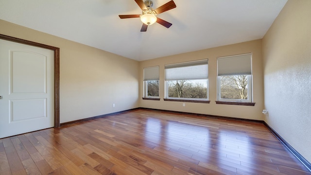 unfurnished room featuring vaulted ceiling, light hardwood / wood-style floors, and ceiling fan