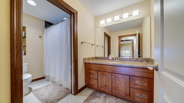 full bathroom with vanity, toilet, and shower / tub combo with curtain