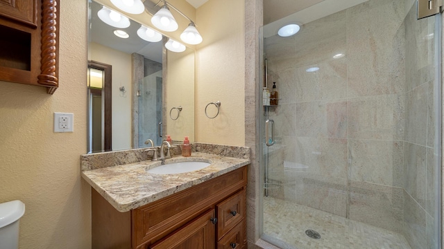 14481 Berglund Rd, Pecatonica, IL 61063 - full bath featuring a stall shower, a textured wall, vanity, and toilet